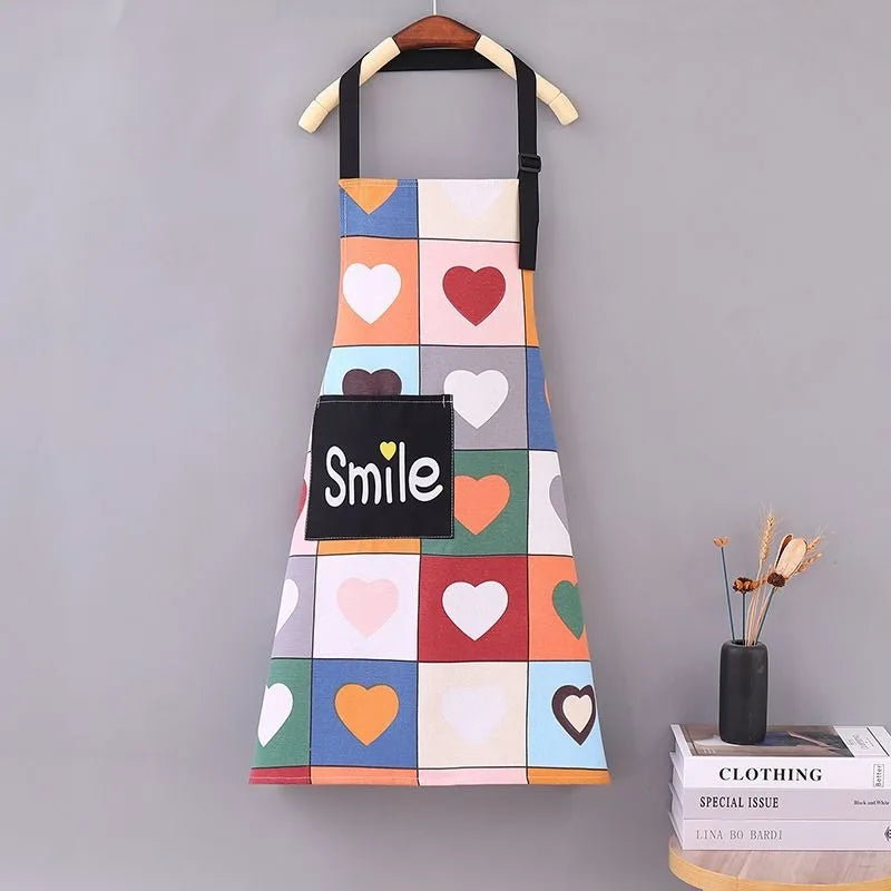 joli tablier de cuisine femme sur un support mural